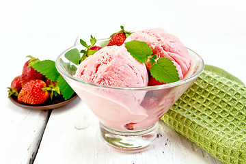 Image showing Ice cream strawberry in glass with berries on board