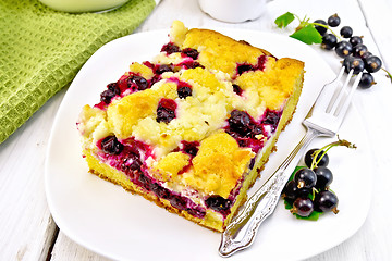 Image showing Pie with black currant in plate with fork on light board
