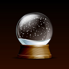 Image showing Snow globe with falling snowflakes.