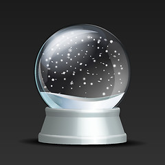 Image showing Snow globe with falling snowflakes.