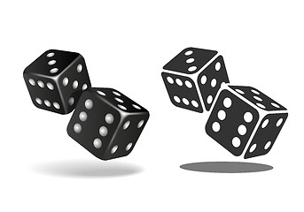 Image showing Two black falling dice isolated on white.