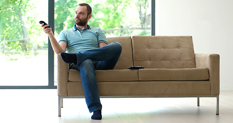 Image showing Happy Man Watching Television