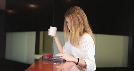 Image showing Blonde drinking coffee enjoying relaxing lifestyle