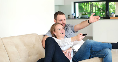 Image showing senoior couple watching tv in modern villa