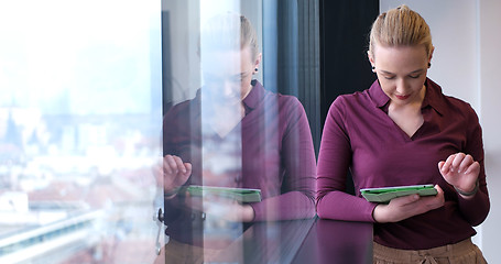 Image showing woman manager using cell telephone in office interior