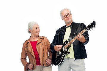 Image showing happy senior couple with electric guitar