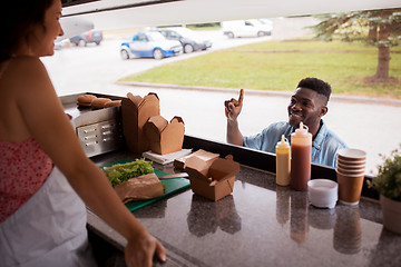 Image showing african american man ordering wok at food truck