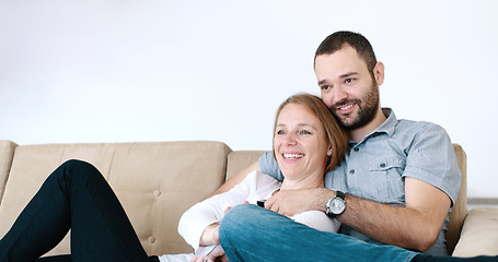 Image showing senoior couple watching tv in modern villa