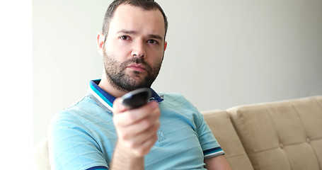 Image showing Happy Man Watching Television