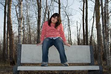 Image showing Girl Sitting on a Bench