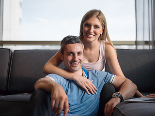 Image showing Attractive Couple Using A Laptop on couch