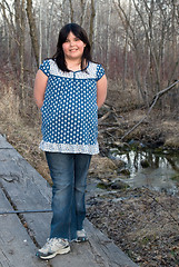 Image showing Girl Standing on Wooden Bridge
