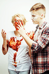 Image showing young pretty couple, lifestyle people concept: girlfriend and boyfriend cooking together, having fun, making mess isolated on white background