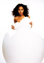 Image showing black skinned woman in big crashed egg