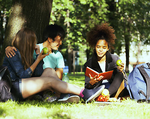 Image showing cute group of teenages at the building of university with books huggings, diversity nations
