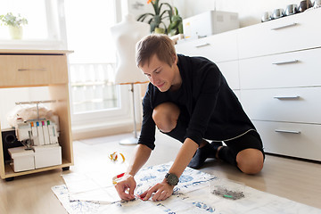 Image showing fashion designer making dress at sewing studio