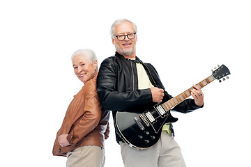 Image showing happy senior couple with electric guitar