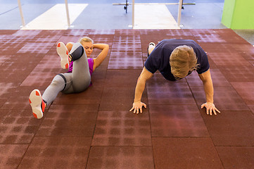 Image showing couple exercising in gym