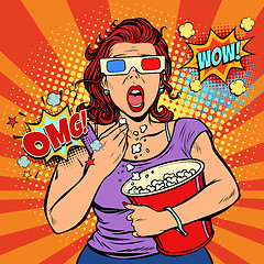 Image showing Woman in 3d glasses watching a scary movie and eating popcorn