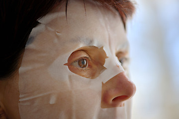 Image showing Woman with facial mask sheet