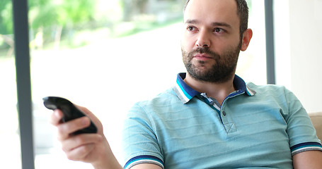 Image showing Happy Man Watching Television