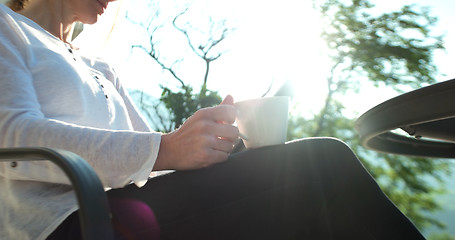 Image showing Happy Couple Drinking Coffee and eating breakfast on terrace of 