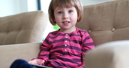 Image showing Child using tablet in modern apartment