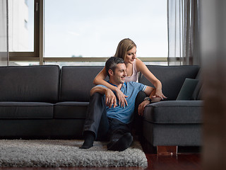 Image showing Attractive Couple Using A Laptop on couch