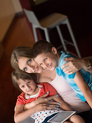 Image showing Young Family Using A Tablet To Make Future Plans