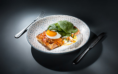 Image showing Scrambled eggs on meat with fried potatoes and toast