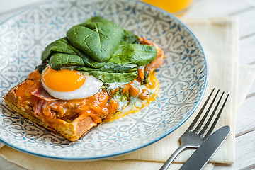 Image showing Scrambled eggs on meat with fried potatoes and toast