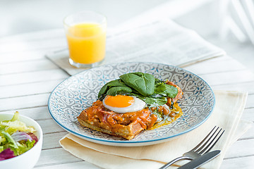 Image showing Scrambled eggs on meat with fried potatoes and toast