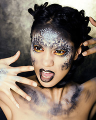 Image showing fashion portrait of pretty young woman with creative make up like a snake