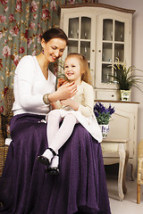 Image showing young mother with daughter at luxury home interior vintage