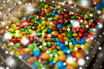 Image showing close up of multicolored dragee candies in box