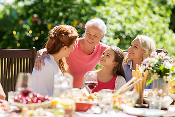 Image showing happy family having dinner or summer garden party