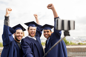 Image showing happy male students or graduates taking selfie