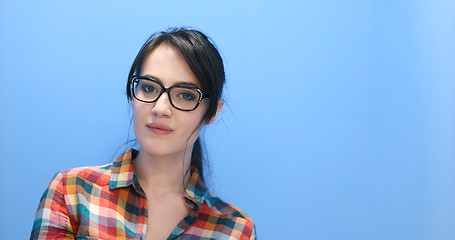 Image showing woman smiling wearing on a pair of large glasses