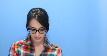 Image showing woman smiling wearing on a pair of large glasses