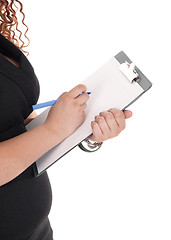 Image showing Business woman with clipboard.