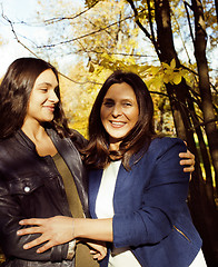 Image showing mature real mother with daughter outside autumn fall in park