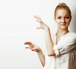 Image showing young blond woman on white backgroung gesture thumbs up, isolate