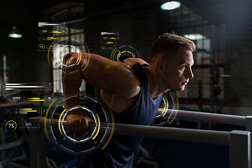 Image showing man doing triceps dip on parallel bars in gym