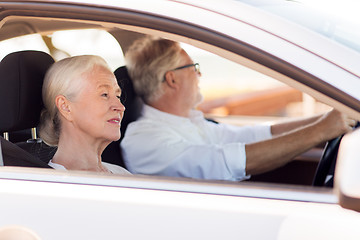 Image showing happy senior couple driving in car