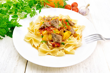 Image showing Farfalle with turkey and vegetables in sauce on table