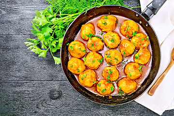 Image showing Meatballs in pan on black board top