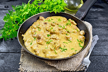 Image showing Meat stewed with cream on board