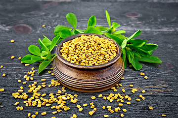 Image showing Fenugreek with leaf in bowl on wooden board