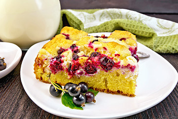 Image showing Pie with black currant in plate on dark board