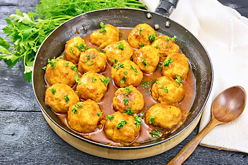 Image showing Meatballs in pan with napkin on board